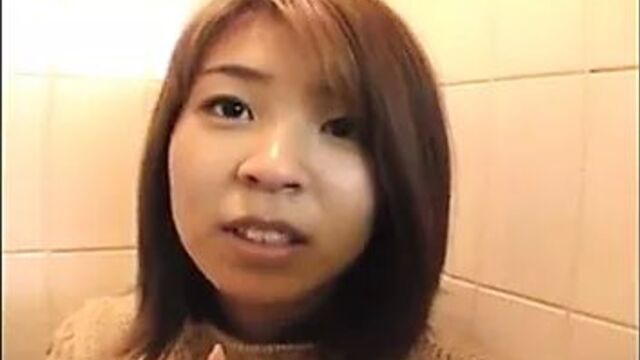 Cute Asian babe foddling with her pussy