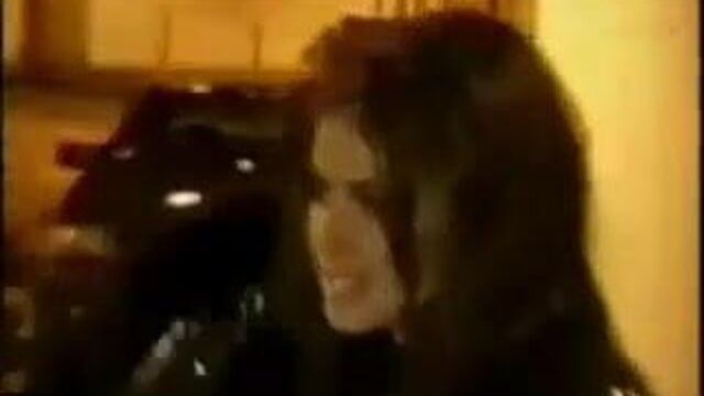 Carmen Electra in glitter suit